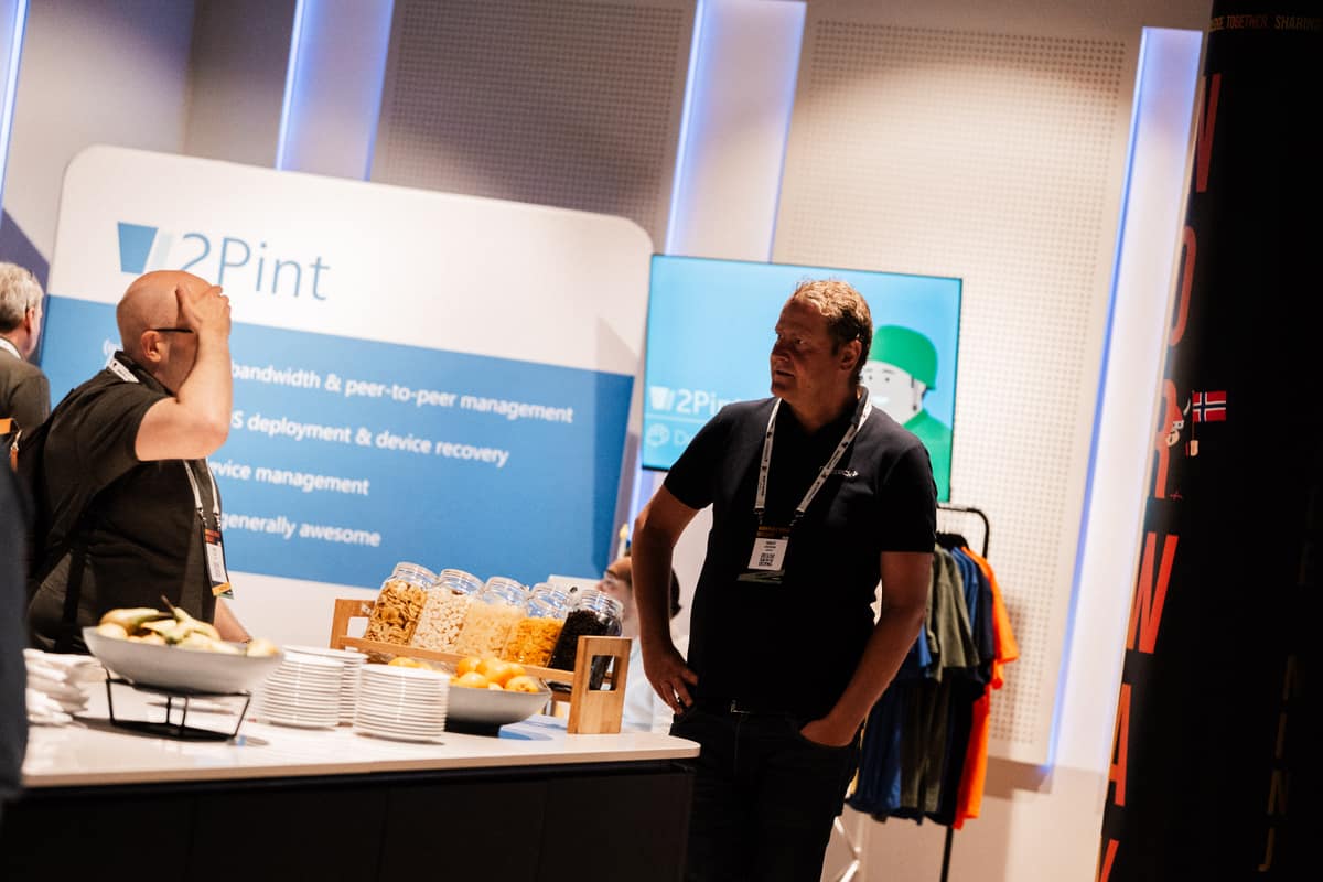 Sponsor booth with refreshments and giveaways at Workplace Ninjas Norway 2026