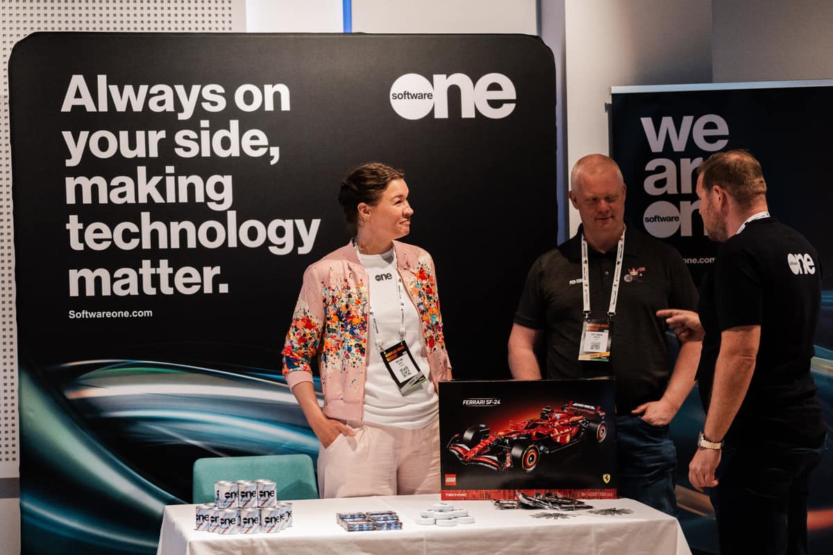 Sponsor team welcoming attendees at their booth during Workplace Ninjas Norway 2026